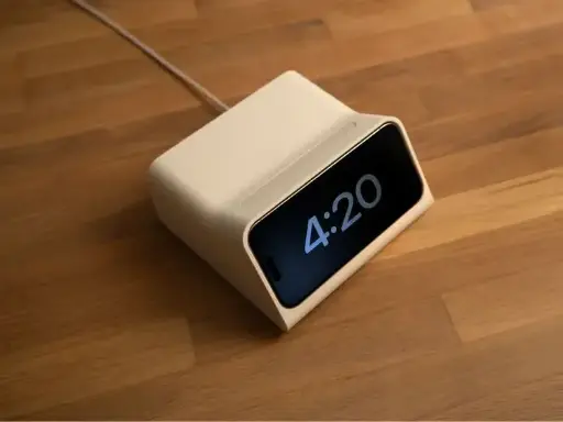 iPhone charging dock with area for AirPods charger
